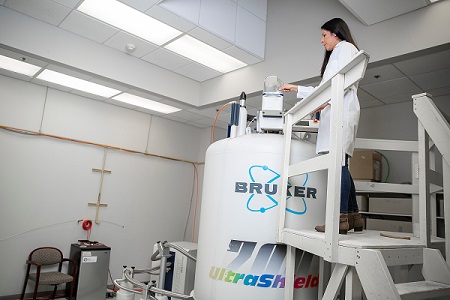 Researcher standing in lab on platform